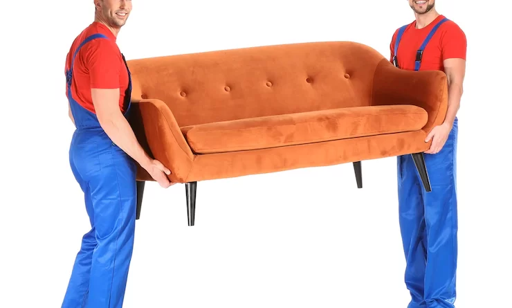loaders-carrying-furniture-against-white